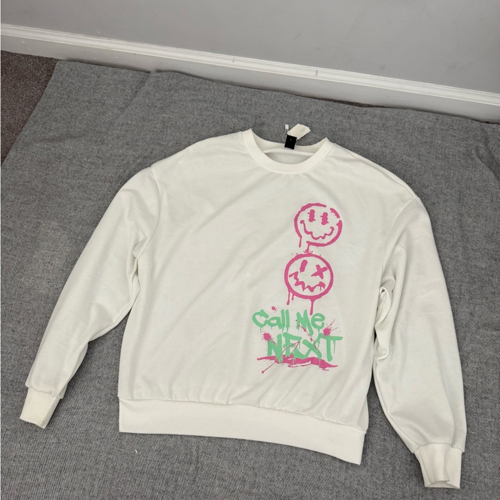 White Sweatshirt with Pink and Green Graphics